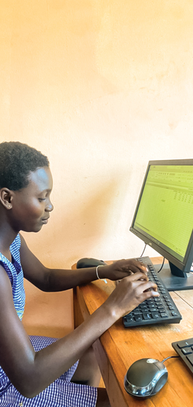 Student gaining hands-on experience with computers during training
