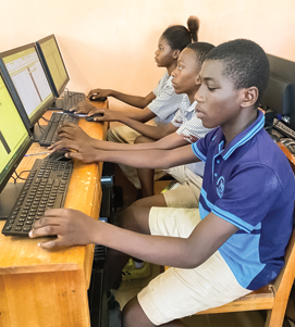 Students concentrating on their screens during a digital learning program