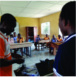 Volunteers assisting students during Rural Tech Hub IT training